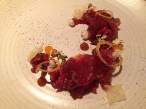 Wagyu tartare and braesola, egg yolk, hay ash and pine nuts