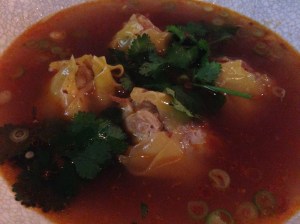 Pork and prawn dumplings with lemongrass broth, dried scallop nam prik, coriander, garlic chips