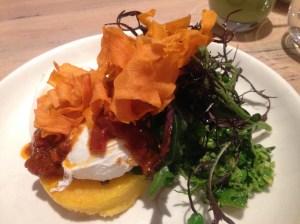 Polenta corn fritter, avocado, and smashed greens, poached eggs, tomato chilli jam salsa, sweet potato crisps