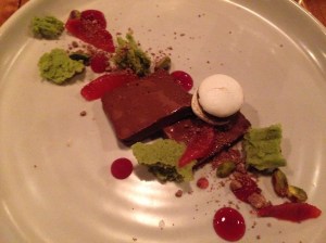 Chocolate marquise, blood orange macaron, pistachio and hibiscus