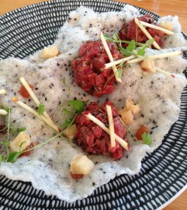 Szechuan spiced beef tartare with Fuji apple, crispy tripe, celery leaves, rice cracker