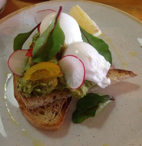Avocado and feta smash on sourdough with poached eggs