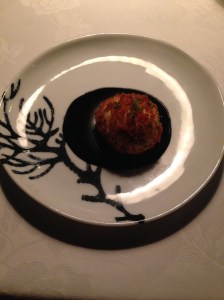 King prawn mousse, rolled in pangrattato, on squid ink sauce