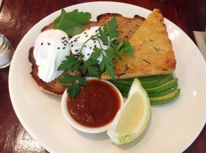 Potato and rosemary rosti with poached eggs on toast, avocado and house relish