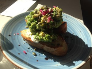 The Hulk - smashed avocado with peas, fresh mint, pickled onion, papitas, sesame, whipped feta and toast, and a poached egg (on the side)