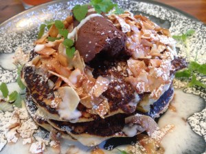 Buttermilk coconut pancakes with mango, lemongrass ganache, kaffir lime cream, and toasted coconut